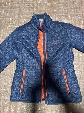 Columbia Blue Quilted Jacket with Orange Accents